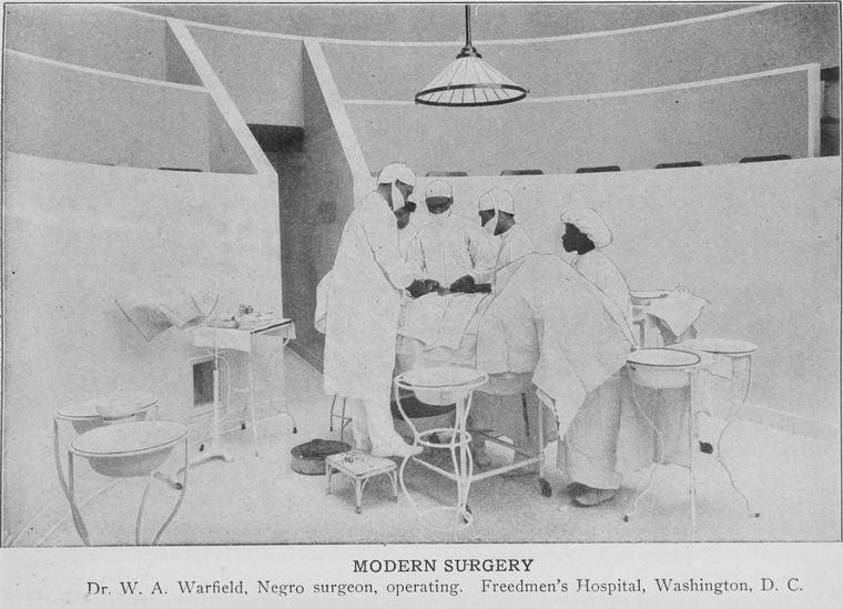 Modern surgery; Dr. W.A. Warfield, Negro surgeon, operating.; Freedmen's Hospital, Washington, D.C.
