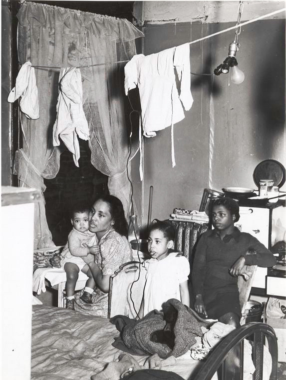 Negro family living in crowded quarters, Chicago, Illinois, April 1941.