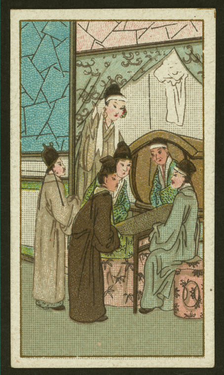 Five women stand and talk around a table