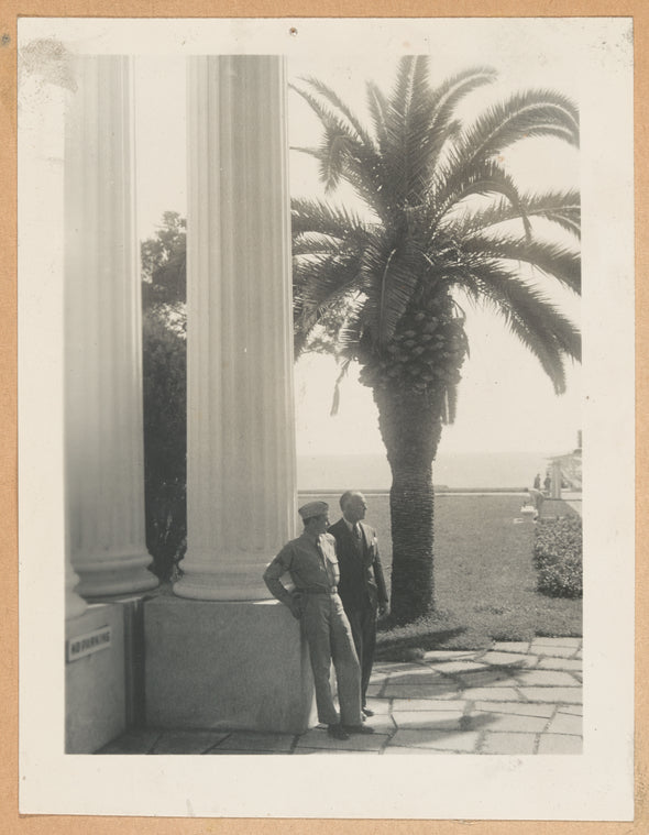 Ted Shawn and Corporal Barton Mumaw standing in front of Hotel Biloxi, Mississippi