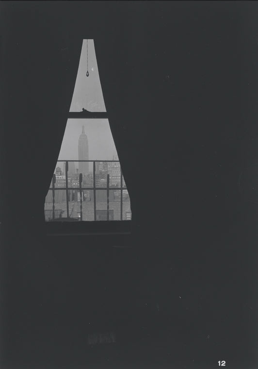 Empire State Building seen through curtains. New York, NY