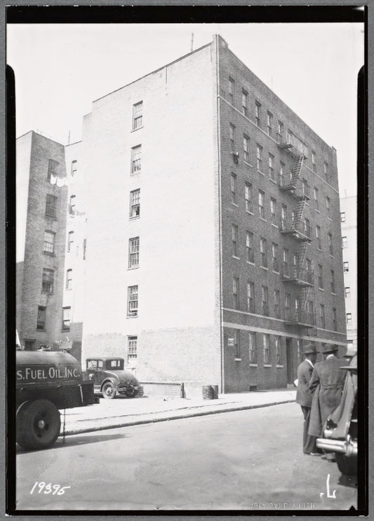 Apartment building; inspectors in street