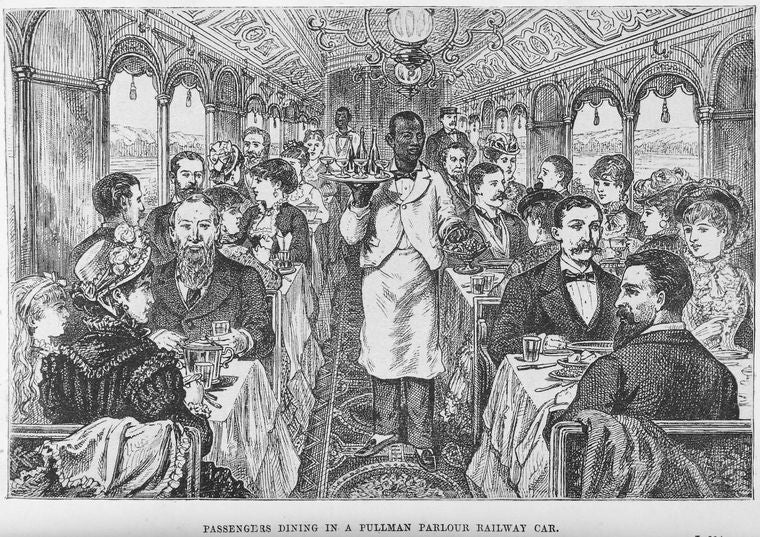 Passengers dining in a Pullman parlour railway car.