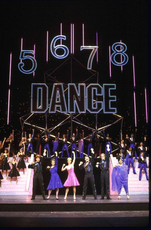 Actors (Front L-R) Ken Sacha, Marge Champion, Sandy Duncan, Don Correia, Bill Irwin & Armelia McQueen w. cast in a scene fr. the  Radio City Music Hall revue "5-6-7-8- Dance!." (New York)