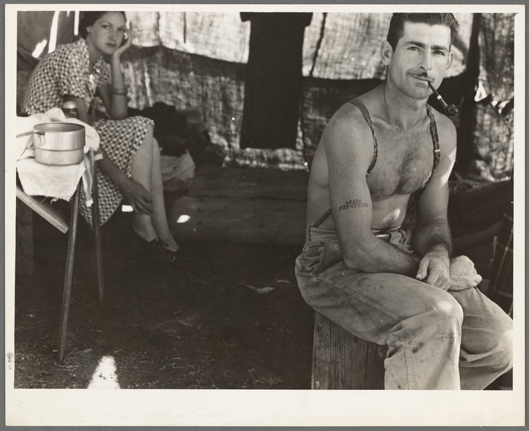 Unemployed lumber worker goes with his wife to the bean harvest. Note social security number tattooed on his arm. Oregon. See general caption number 46