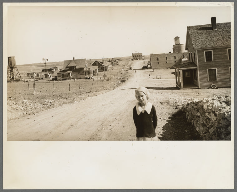 The town of Mills, New Mexico. The grain elevator in background at right has been long ago abandoned. The bank is closed