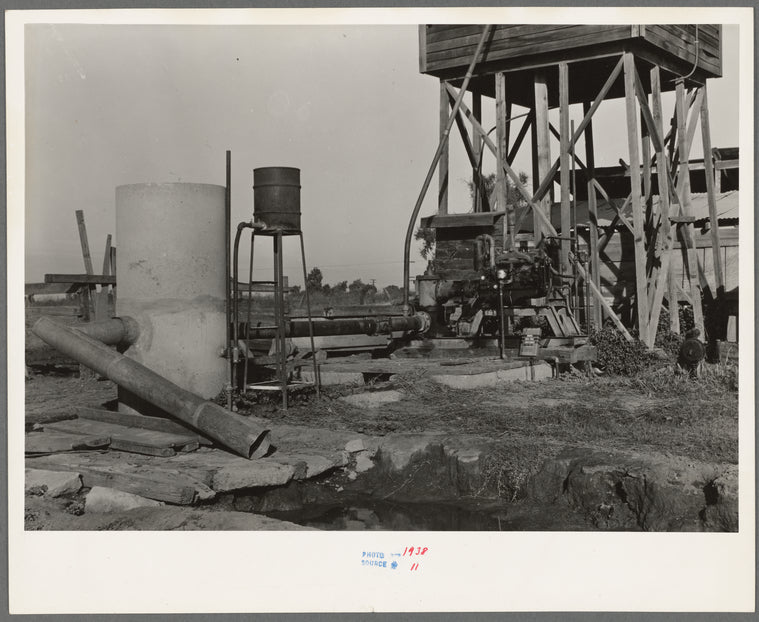 This pumping plant for irrigation is powered by a natural gas engine which operates at about half the cost of electricity. Tulare County, California