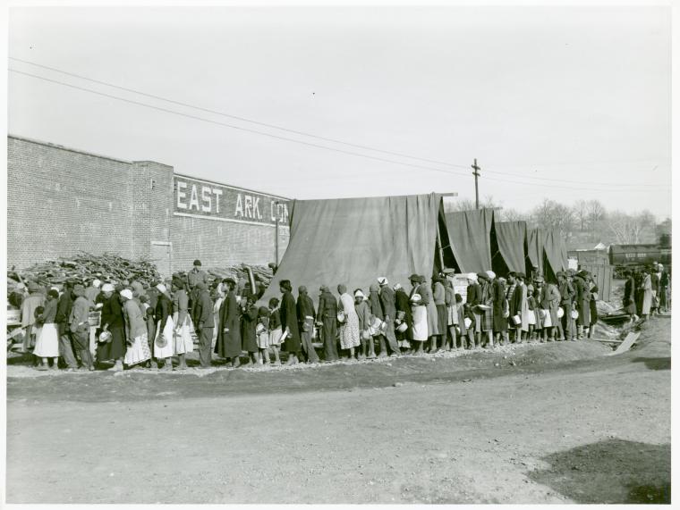 Negro flood refugees lined up and waiting for food in Forrest City, Arkansas camp; Feb. 1937.