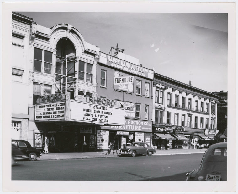 North side of East 125th Street, from Nos. 165 to 171, Harlem, New York City, 1951. Includes the Tri-boro movie theater and the Happy Hank Auction Company.