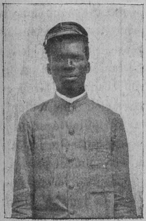 Haitian man wearing a kepi.
