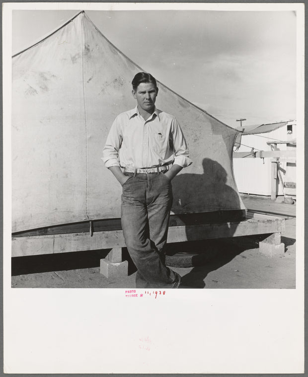 Migrant cotton picker's child who lives in a tent in the government camp instead of along the highway or in a ditch bank. Shafter Camp for migrants, California