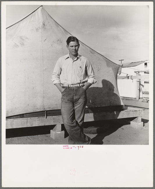 Migrant cotton picker's child who lives in a tent in the government camp instead of along the highway or in a ditch bank. Shafter Camp for migrants, California