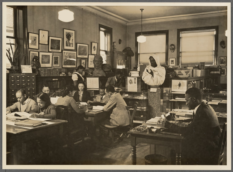 Reading room of the Schomburg Collection at the 135th Street Branch Library. Lawrence Reddick, curator, seated at right
