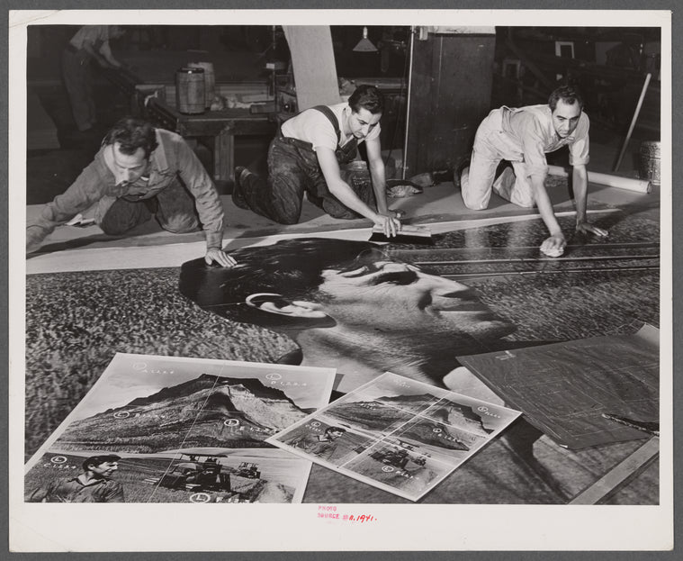 Workers working on installation of war bond mural. Grand Central Station, New York, New York.