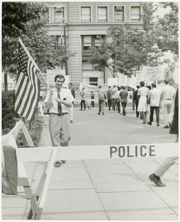 Leo Skir with American flag in picket line