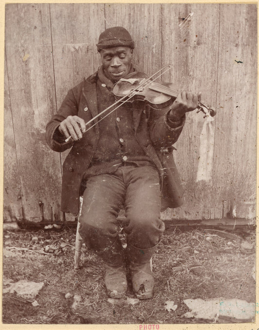 Joe Izzard playing the fiddle