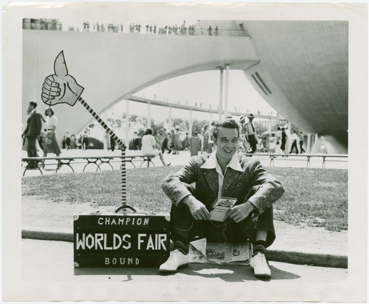 Transportation to Fair - Hitchhikers - Man and mechanical hand in suitcase
