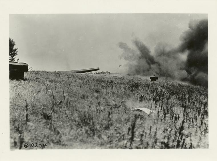 Big gun disappearing from ships offshore.