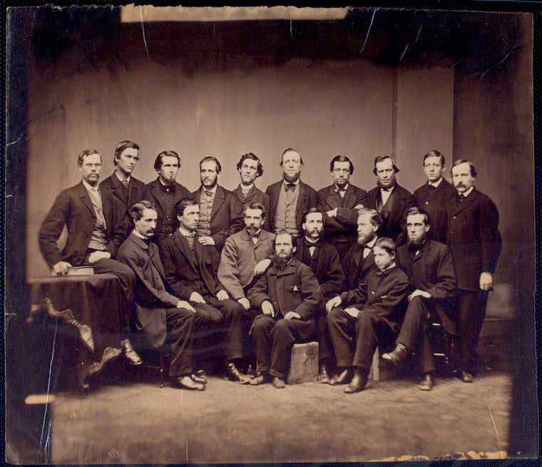 Group of USSC personnel; eight seated in front, ten standing in rear.