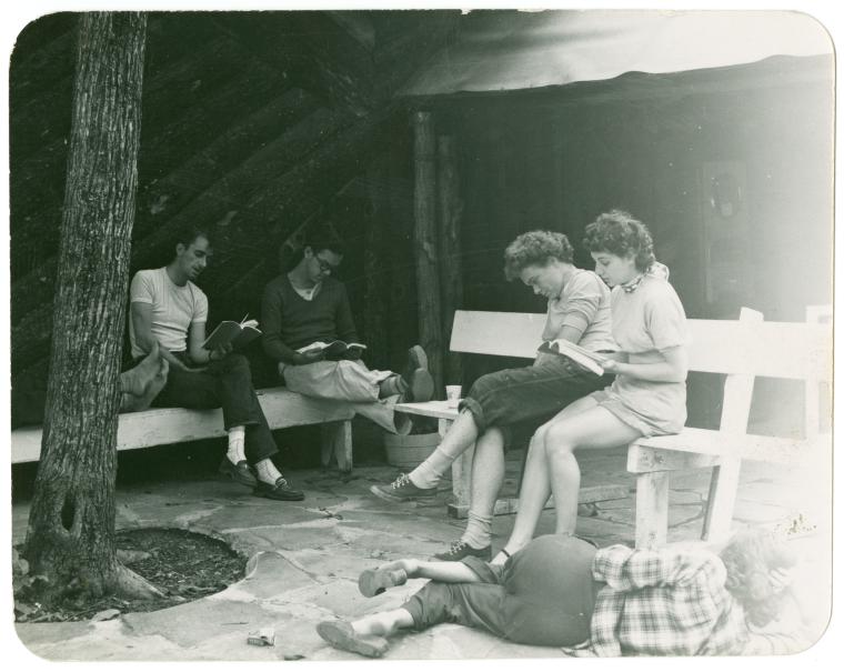 Snapshot of unidentified individuals studying scripts in Woodstock, NY