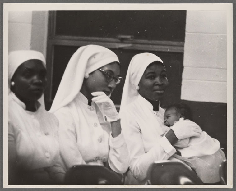 Betty Shabazz holding Qubilah, circa 1960