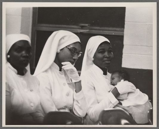 Betty Shabazz holding Qubilah, circa 1960