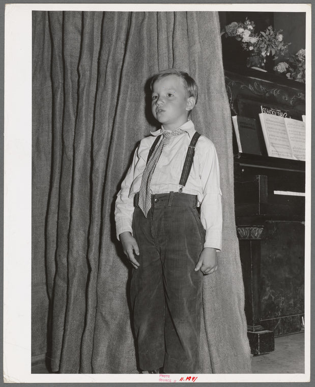 Boy giving recitation in program at end of school term. FSA (Farm Security Administration) labor camp. Caldwell, Idaho