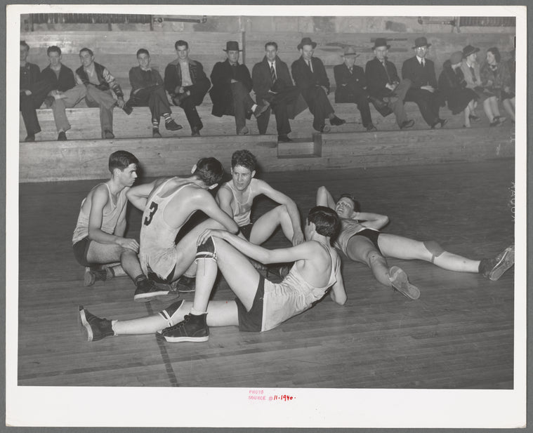 Basketball players resting between periods. Eufaula, Oklahoma