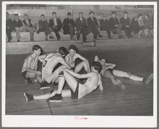 Basketball players resting between periods. Eufaula, Oklahoma