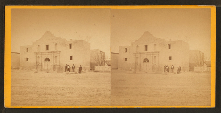 View of four men standing in front of the Alamo.