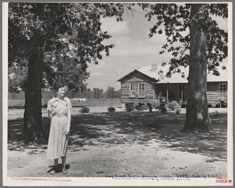 New House. Daughter of resettled farmer in foreground. Wolf Creek Farms, Ga