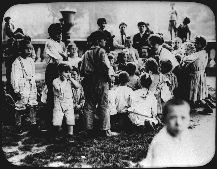 Story hour group in Hudson Park, adjoining Hudson Park Branch, 1910