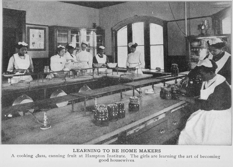 Learning to be home makers; a cooking class, canning fruit at Hampton Institute.; The girls are learning the art of becoming good housewives.