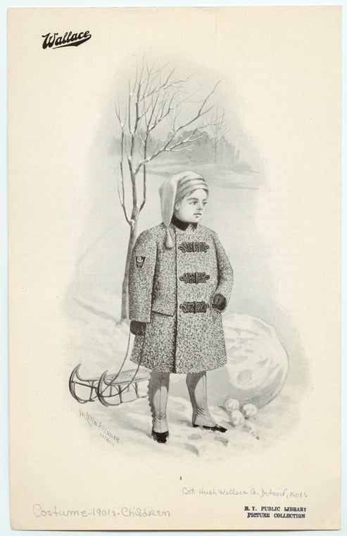Boy in winter coat with a sled