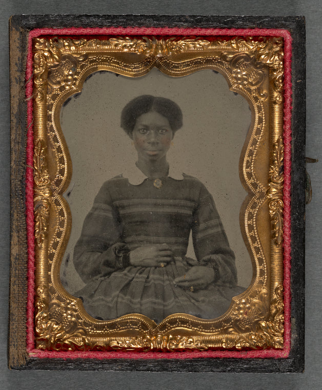 Young Black Woman Wearing Striped Dress With White Collar
