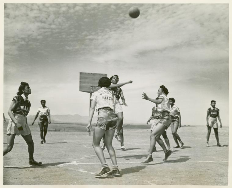 African American women, members of the 32nd and 33rd Company's Women's Army Auxiliary Corps basketball team, playing a game of basketball at Fort Huachuca