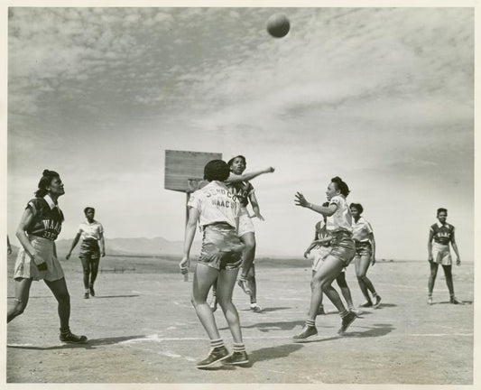 African American women, members of the 32nd and 33rd Company's Women's Army Auxiliary Corps basketball team, playing a game of basketball at Fort Huachuca