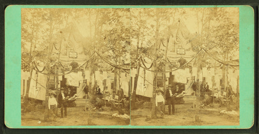 Cottage and yard decorated with bunting.