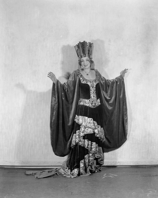 June Cochrane (as Mistress Evelyn La Belle-Ans)[?].