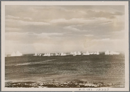 A fiery blockade of England!  Like a curtain of iron the fire from German coastal guns falls across the entrance to a Channel harbor.  No English ship can get through this