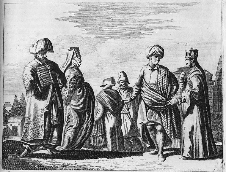[A group of people wearing ornate clothing.]