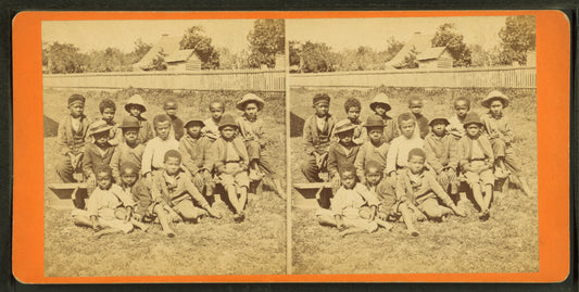 Group of natives. [Group portrait of children on benches.]