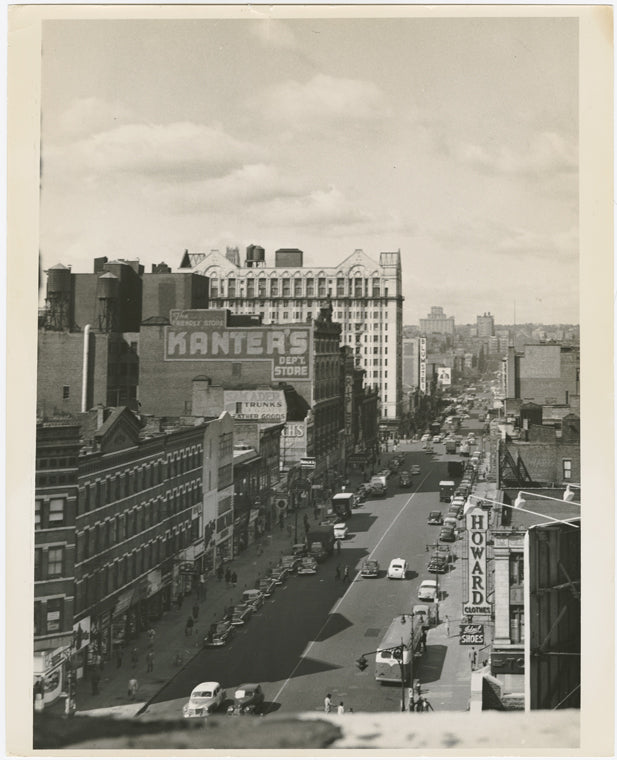 View of West 125th Street, looking west towards Seventh Avenue, with the Hotel Theresa at center behind Kanter's Department Store, ca. 1940s