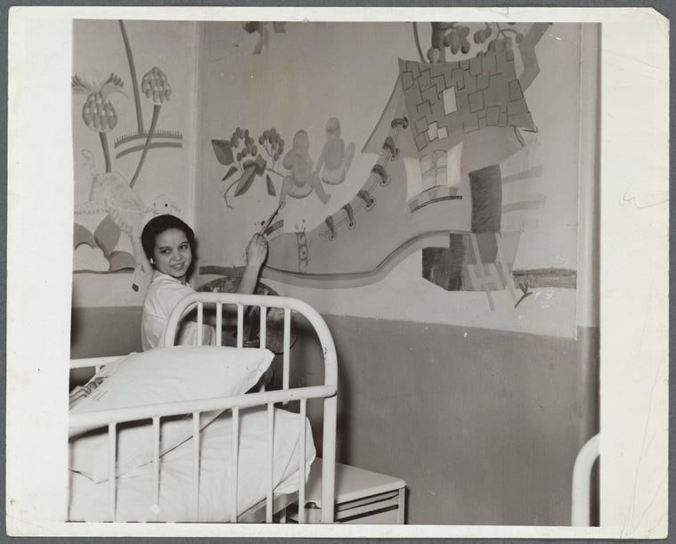 Miss Selma Day working on mural