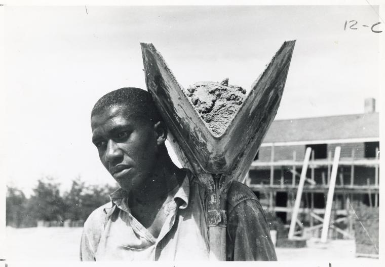 [An African American man with a shovel.]