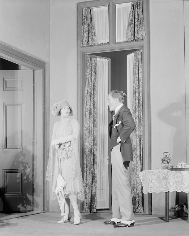 Lynn Fontanne as Eliza Doolittle and Reginald Mason as Professor Higgins.