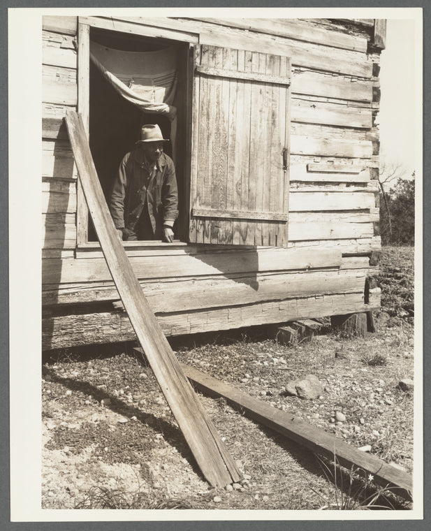 Tenant farmer in his cabin. Macon County, Alabama