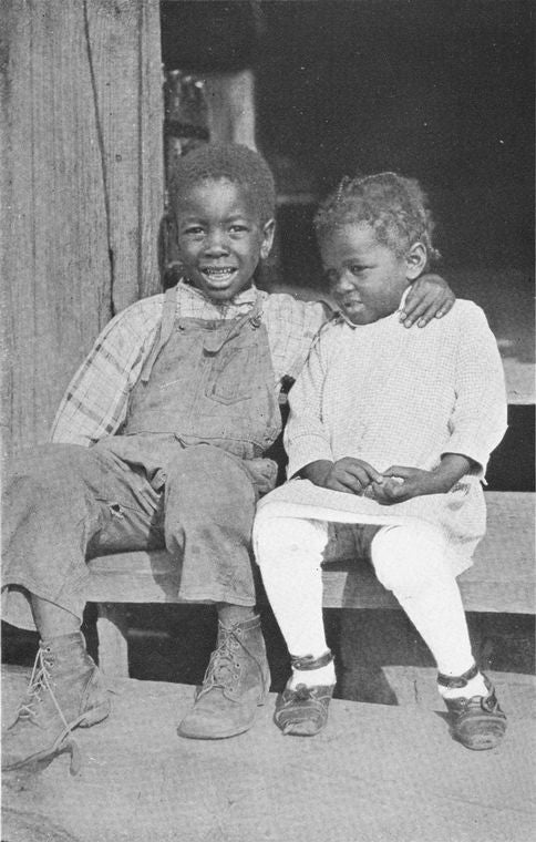 African American children sitting on the stairs