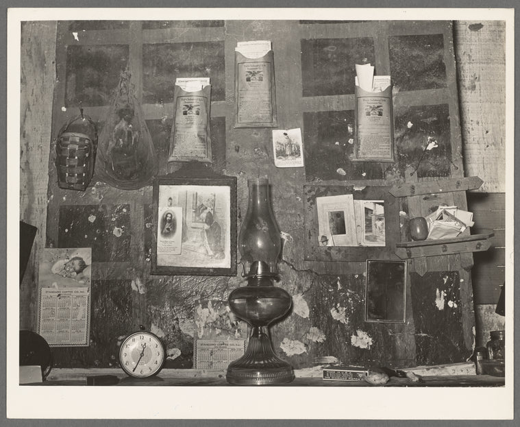 Decorations above mantle in Negro home along the levee. Norco, Louisiana. Note the life insurance policies