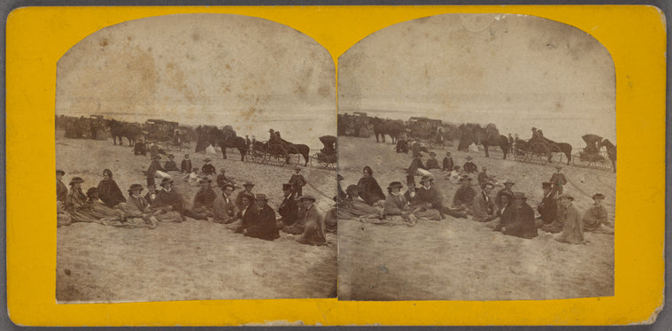 A large party resting on Sailsbury beach, a line of carriages beyond